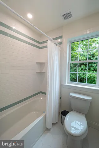 a bath tub sitting in front of a window
