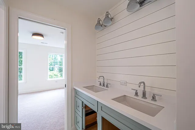 a bathroom with a bathtub and a sink