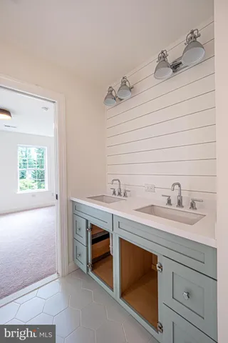 a bathroom with a shower sink and mirror