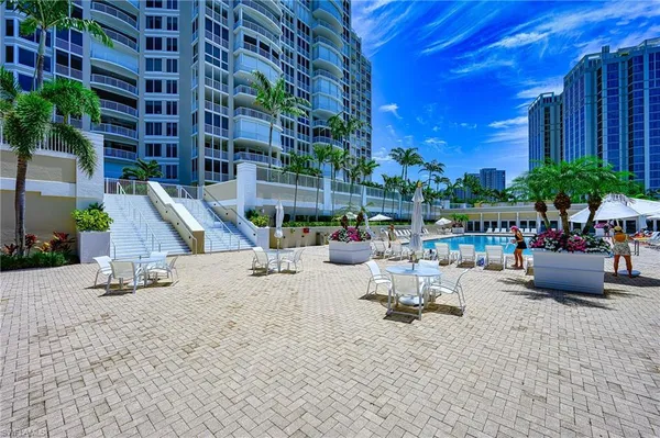 a view of a backyard with sitting area