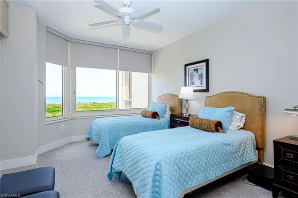 a bedroom with bed and window