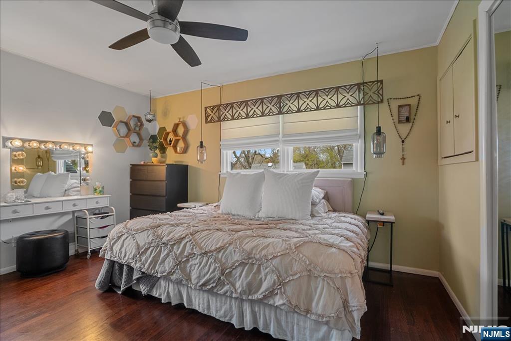 11 Westland Road Verona, NJ 07044 - Photo 14 of 29 a bedroom with a large bed and a chandelier