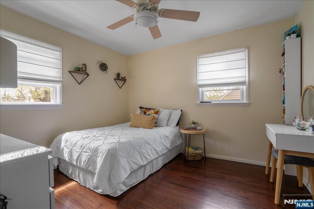 11 Westland Road Verona, NJ 07044 - Photo 15 of 29 a bedroom with a bed and a table in it