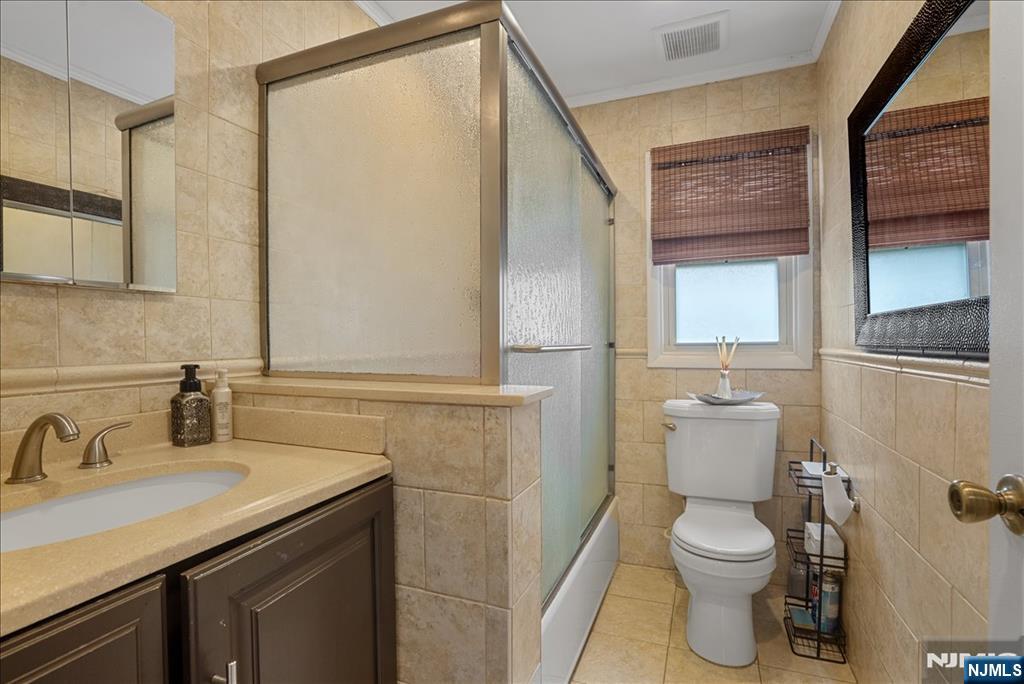 11 Westland Road Verona, NJ 07044 - Photo 18 of 29 a bathroom with a granite countertop sink toilet and shower