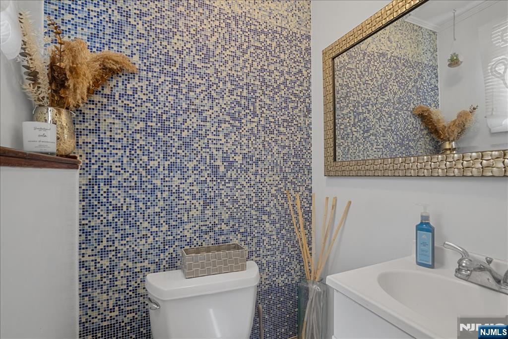11 Westland Road Verona, NJ 07044 - Photo 19 of 29 a bathroom with a toilet and sink