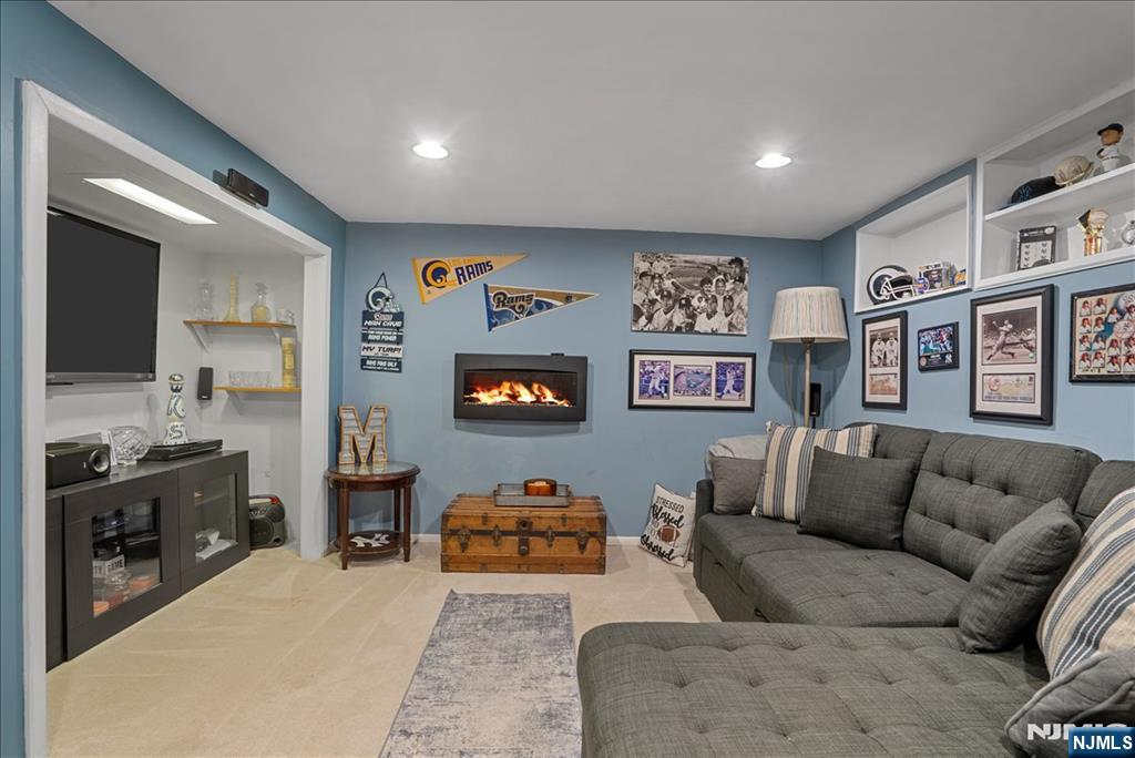 11 Westland Road Verona, NJ 07044 - Photo 23 of 29 a living room with furniture and a flat screen tv