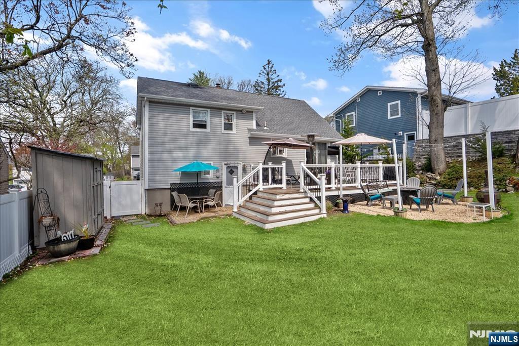 11 Westland Road Verona, NJ 07044 - Photo 24 of 29 a view of a house with backyard porch and sitting area