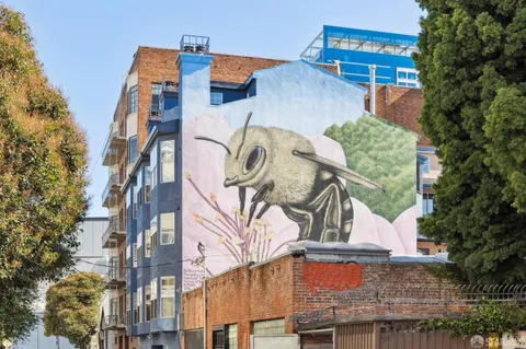 a view of a building with a tree