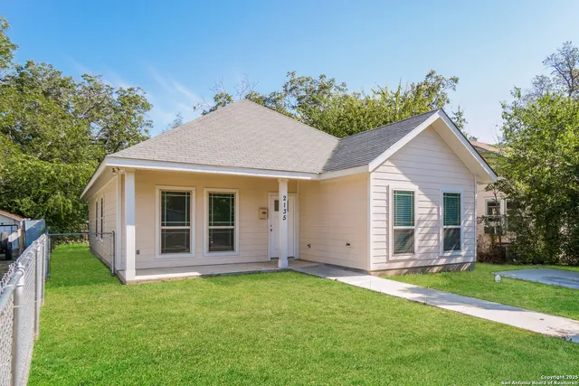 front view of a house with a yard