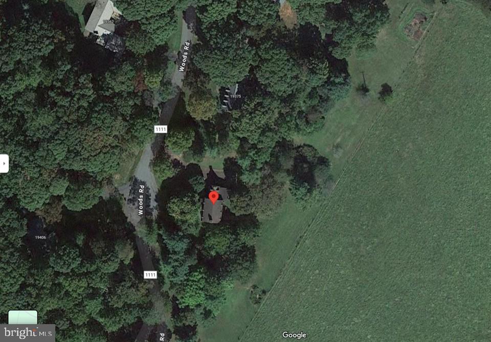 19389 Woods Road Culpeper, VA 22701 - Photo 6 of 7 a backyard of a house with a yard and outdoor seating