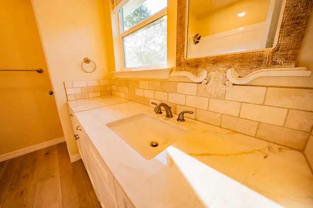 a view of backyard with large trees