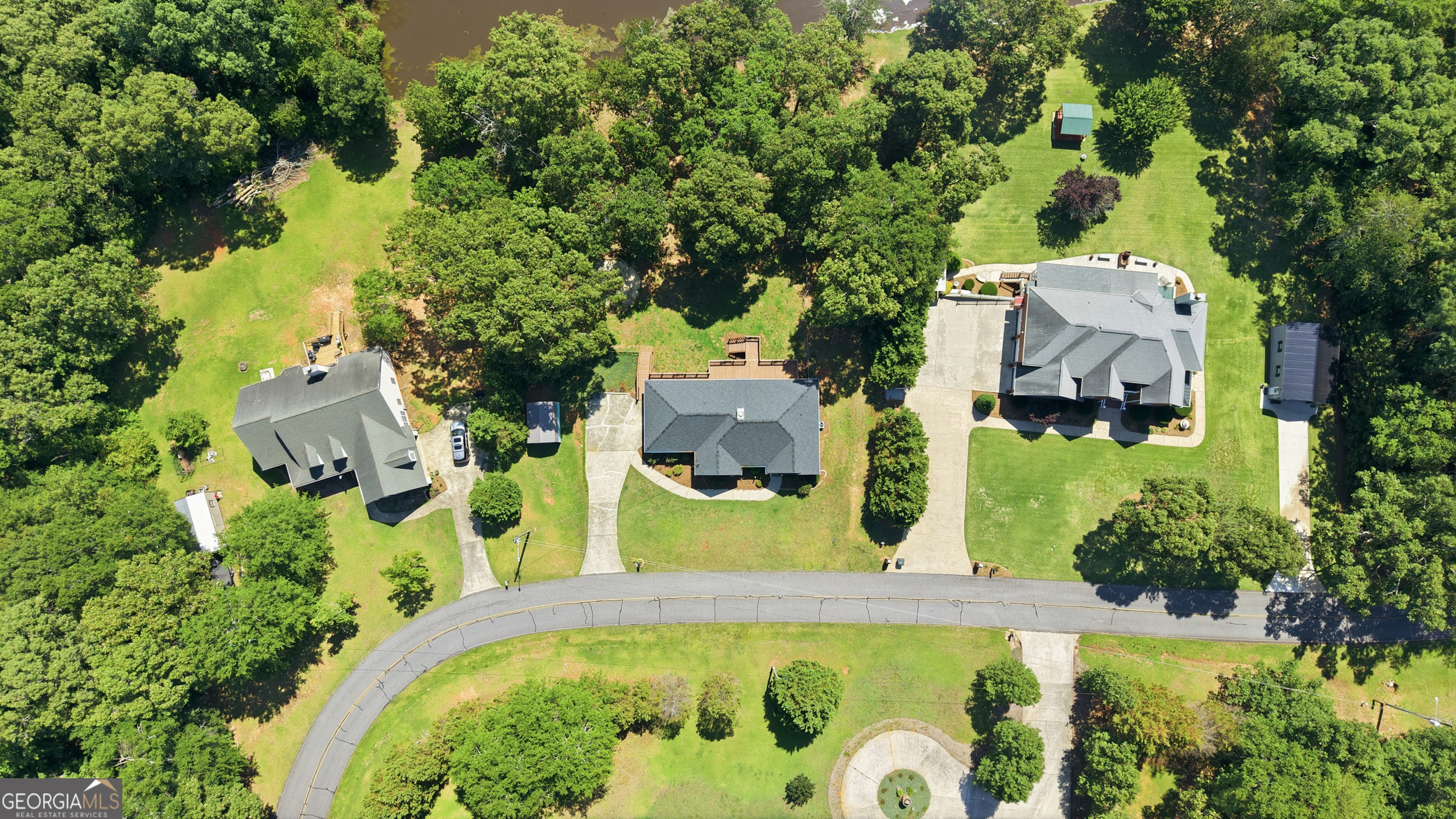 171 Winding Way Hartwell, GA 30643 - Photo 31 of 37 an aerial view of a house with swimming pool and large trees