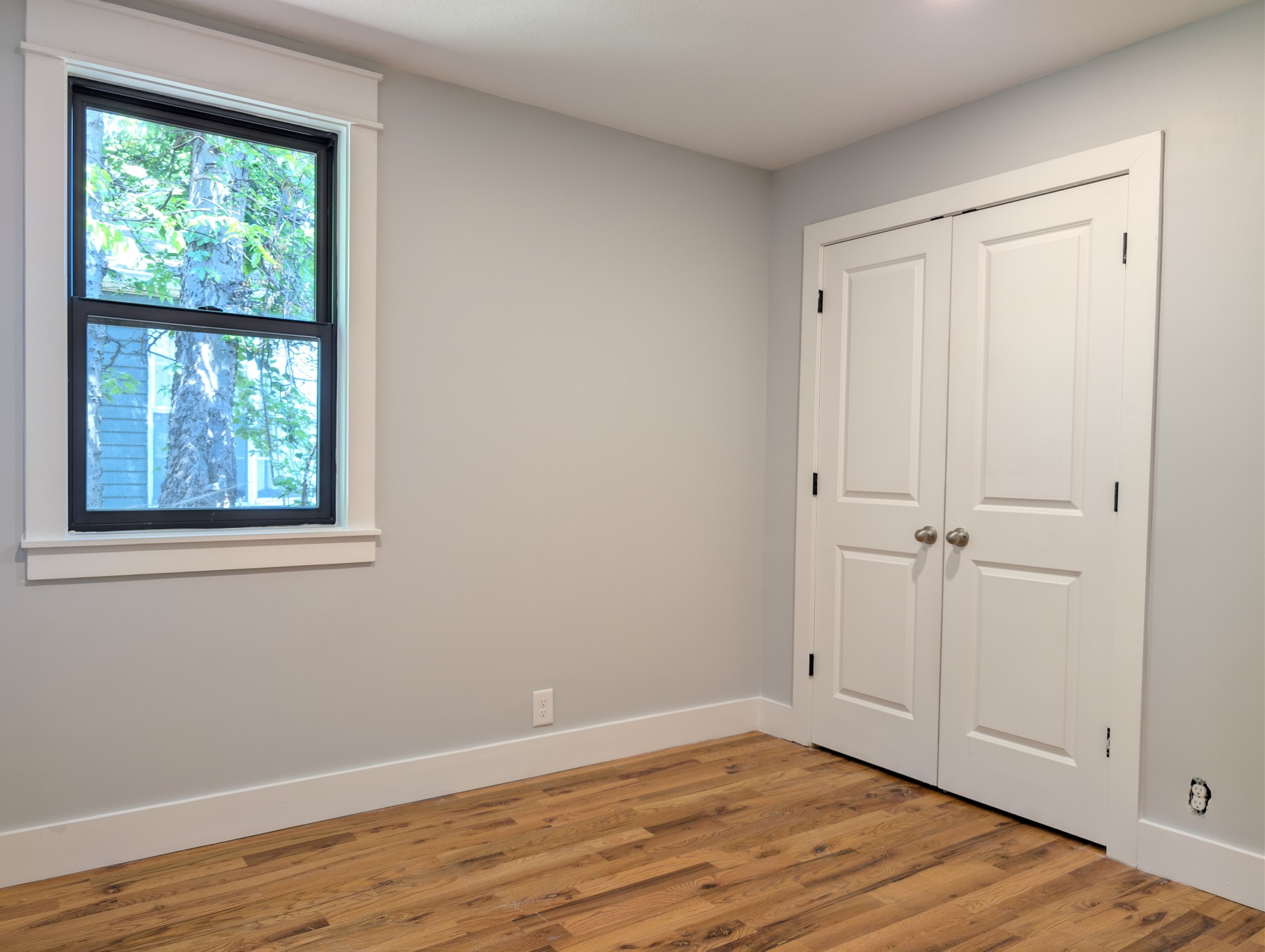 244 Warrior Road Madison, TN 37115 - Photo 13 of 24 a view of an empty room with wooden floor and a window