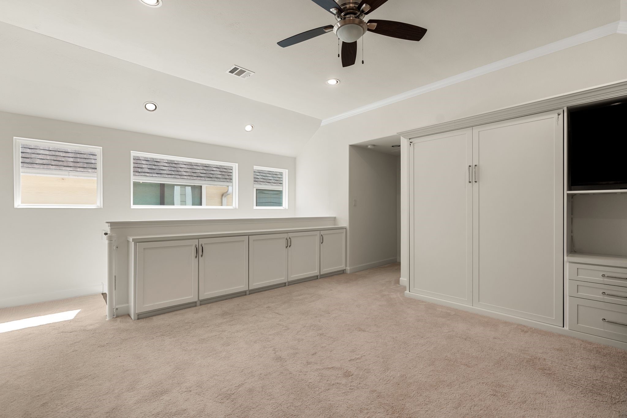 5230 Darling Street Houston, TX 77007 - Photo 16 of 34 The built-ins are the best way to keep the clutter of daily living hidden away. And speaking of hidden- the cabinets to the right are a big surprise...