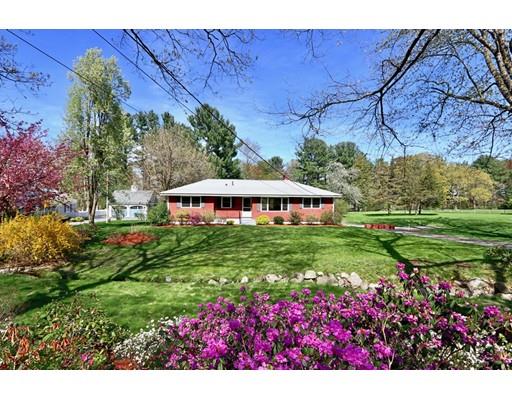 103 Harvard Road Littleton, MA 01460 - Photo 4 of 30 a view of a house with a big yard and potted plants
