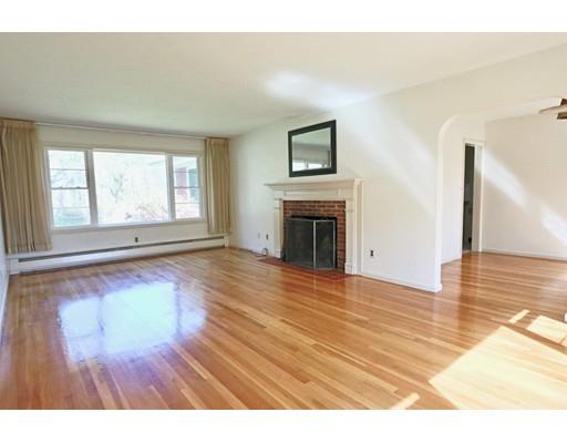 103 Harvard Road Littleton, MA 01460 - Photo 8 of 30 a view of empty room with wooden floor and fireplace