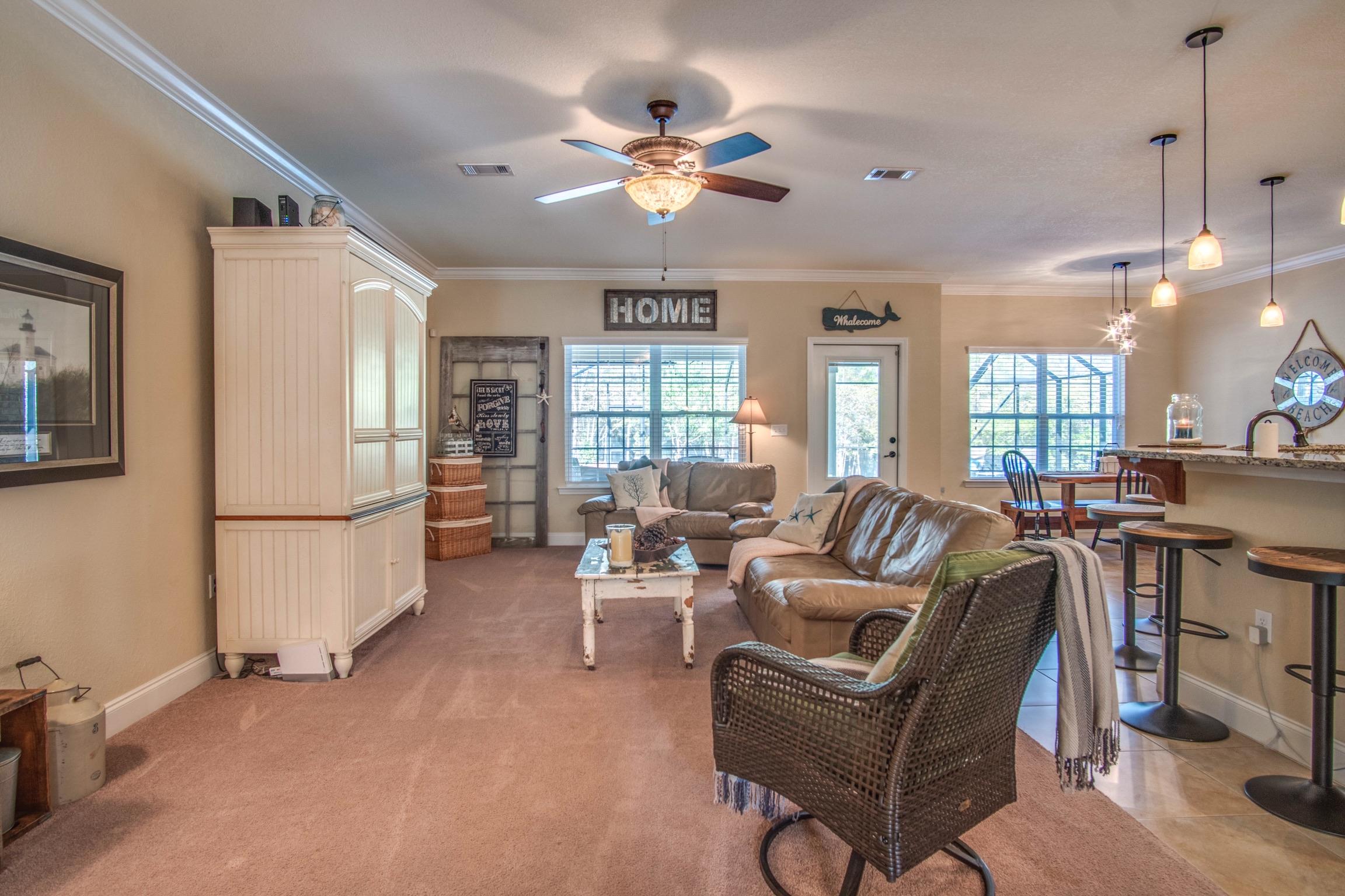6314 Possum Ridge Road Crestview, FL 32539 - Photo 6 of 47 a living room with furniture a dining table and chairs