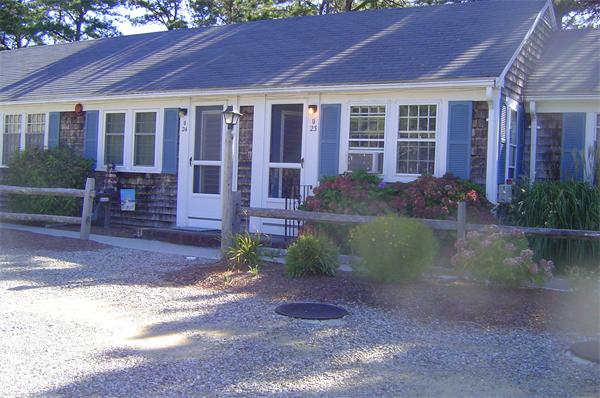 82 Lower County Road, Unit 23 Dennis, MA 02639 - Photo 1 of 1 a front view of a house with garden
