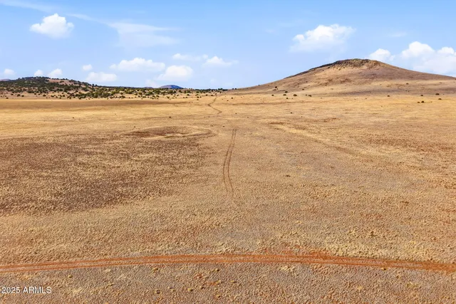 a view of an ocean and mountain
