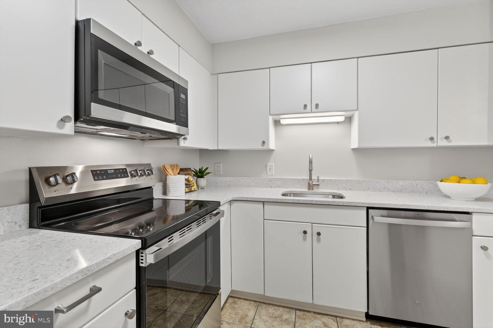 2111 Wisconsin Avenue Northwest, Unit 210 Washington, DC 20007 - Photo 9 of 23 Updated kitchen with pass thru