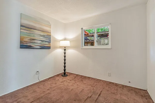 a view of a room that has a window in it