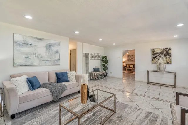 a living room with furniture and a rug