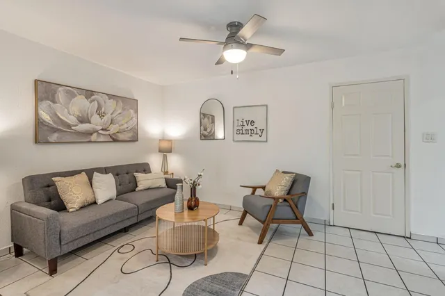a living room with furniture and a window