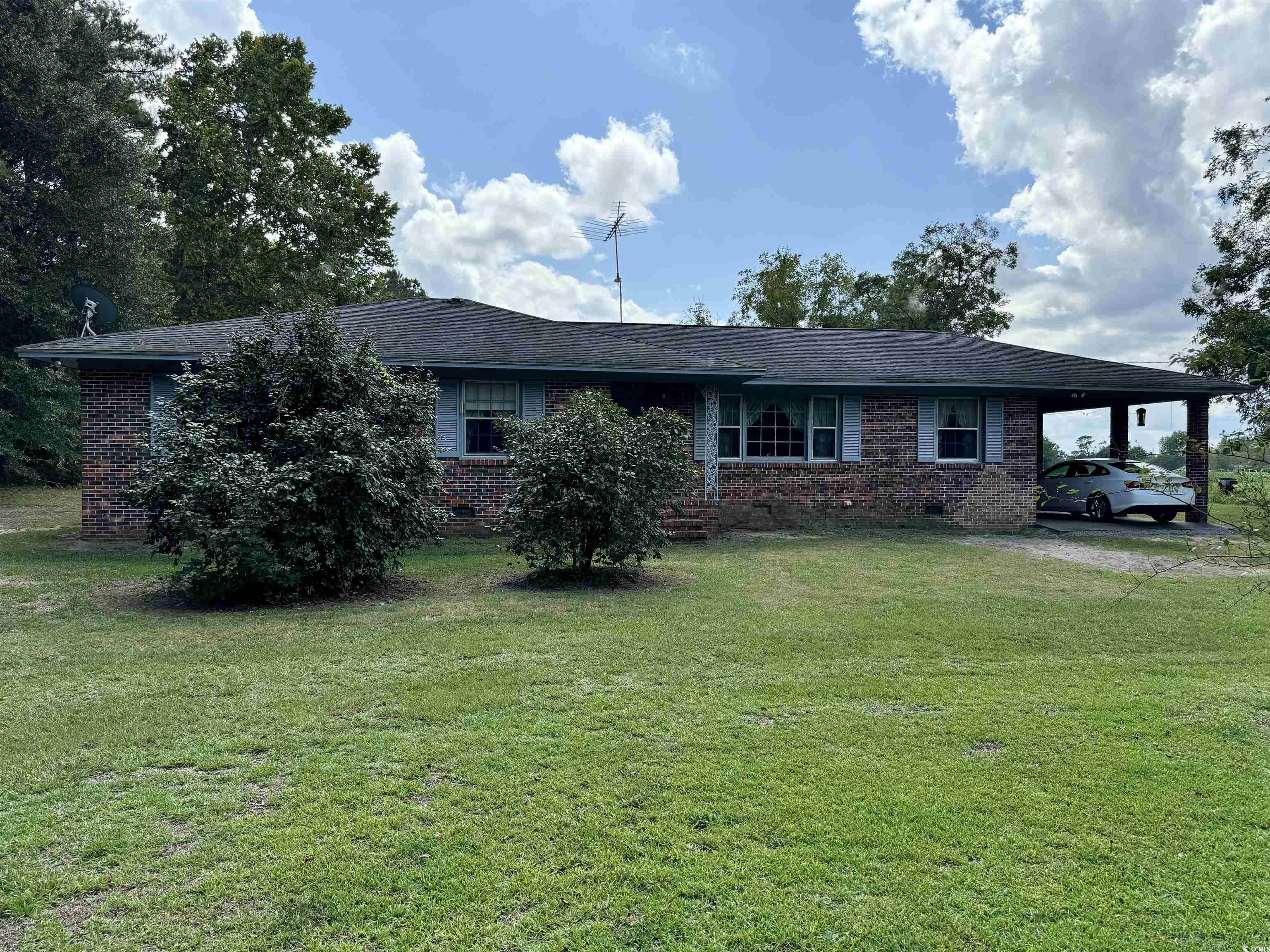 347 Harpers Road Marion, SC 29571 - Photo 27 of 35 Exterior space featuring a front yard and a carport