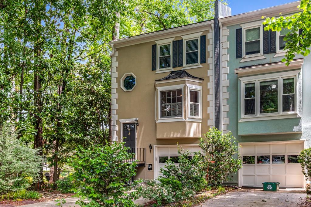 55 Sycamore Station, Unit 55 Decatur, GA 30030 - Photo 1 of 1 a view of a house with a tree beside it