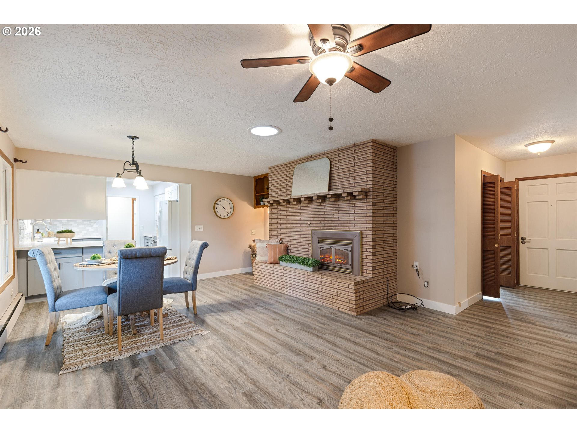 1103 East Main Street Hillsboro, OR 97124 - Photo 12 of 33 a dining room with furniture a chandelier and wooden floor