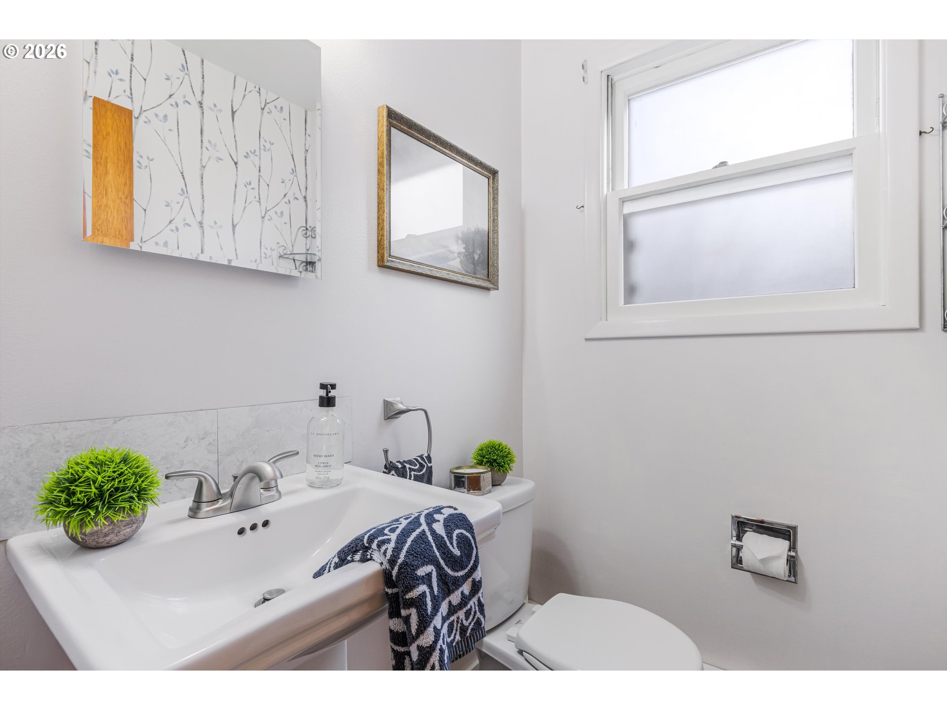 1103 East Main Street Hillsboro, OR 97124 - Photo 17 of 33 a bathroom with a sink and a mirror