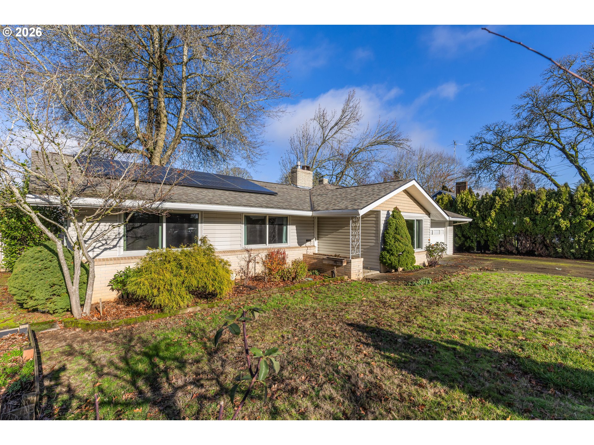 1103 East Main Street Hillsboro, OR 97124 - Photo 2 of 33 a front view of a house with a yard