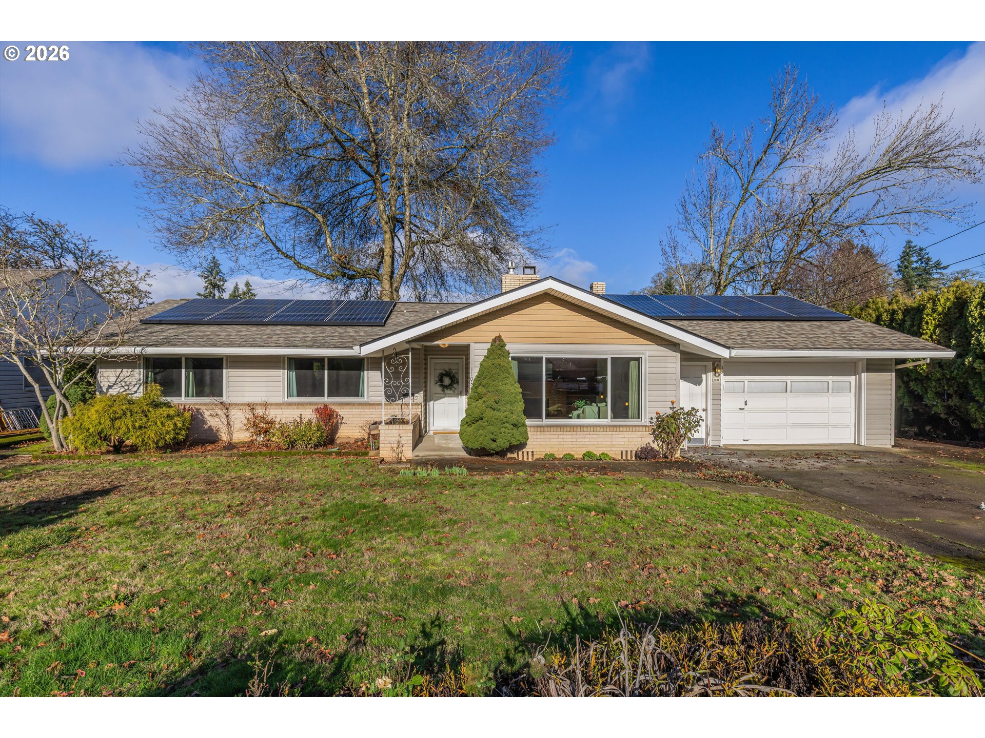 1103 East Main Street Hillsboro, OR 97124 - Photo 3 of 33 a front view of a house with a garden