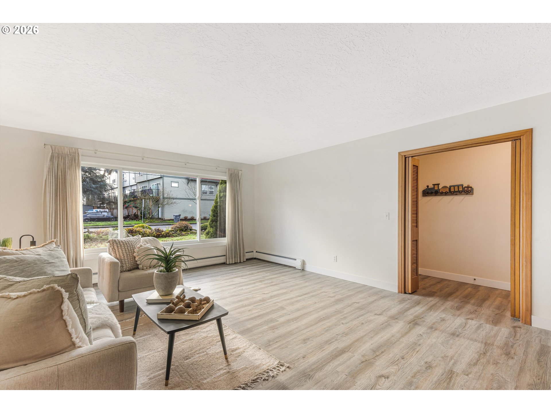 1103 East Main Street Hillsboro, OR 97124 - Photo 10 of 33 a living room with furniture and a large window