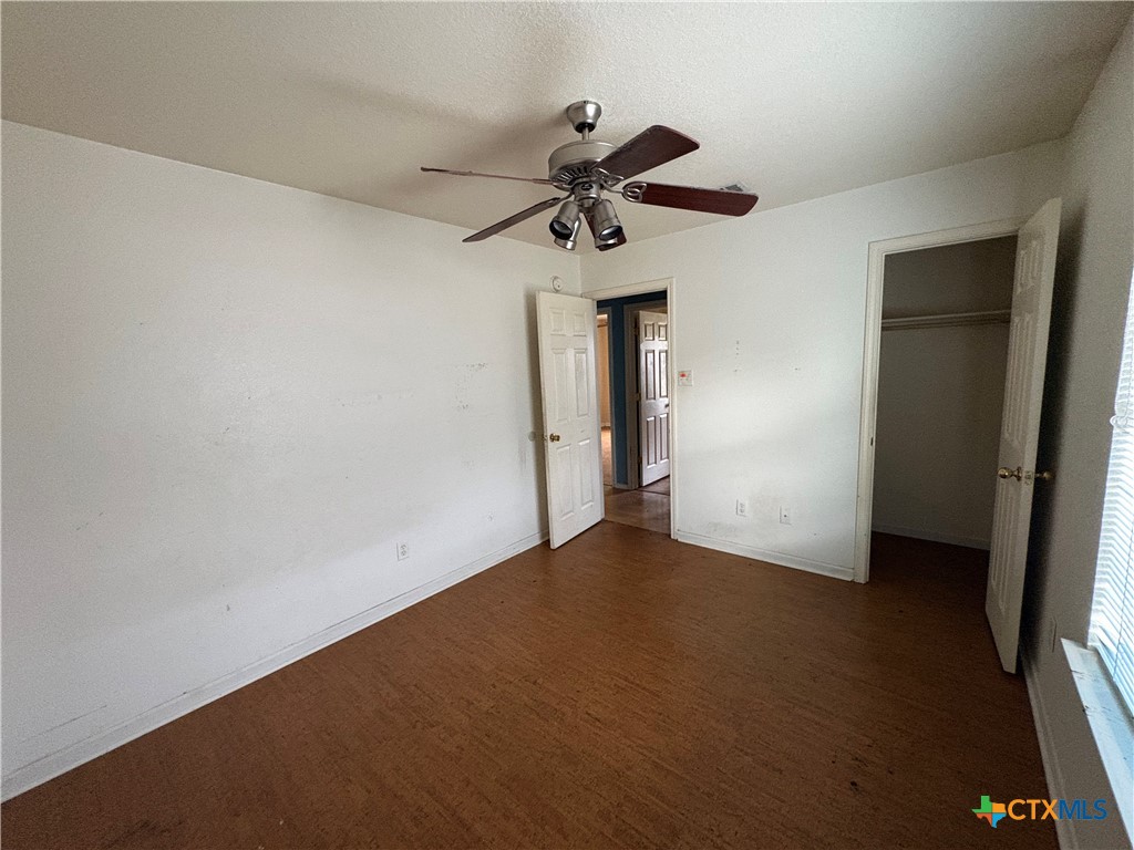 206 Timber Ridge Drive Nolanville, TX 76559 - Photo 14 of 21 a view of an empty room with a ceiling fan