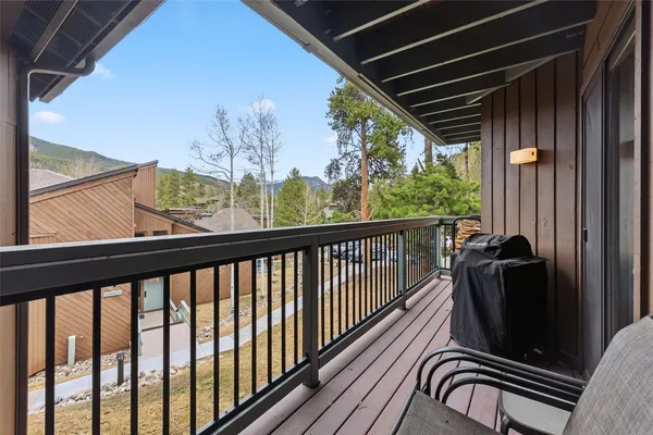 a view of a balcony with furniture