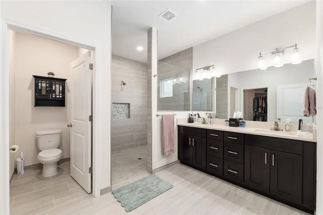 a view of closet with wooden floor