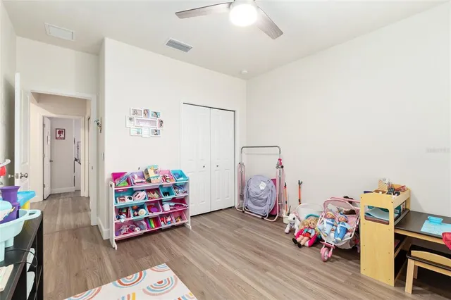 a view of a swimming pool with outdoor seating and lake view