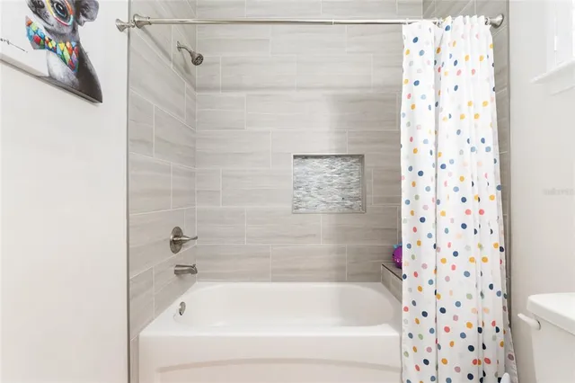 an aerial view of a house with a ocean view