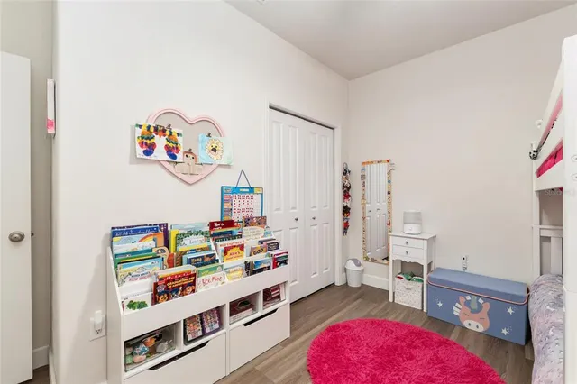 an aerial view of a house with a big yard