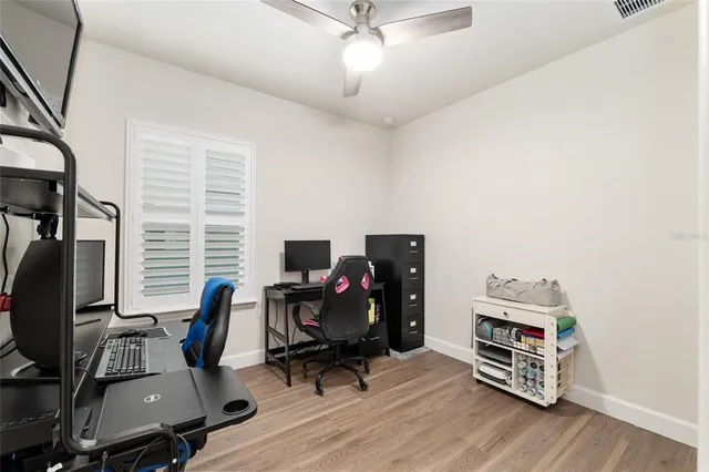 an aerial view of residential houses with outdoor space and swimming pool