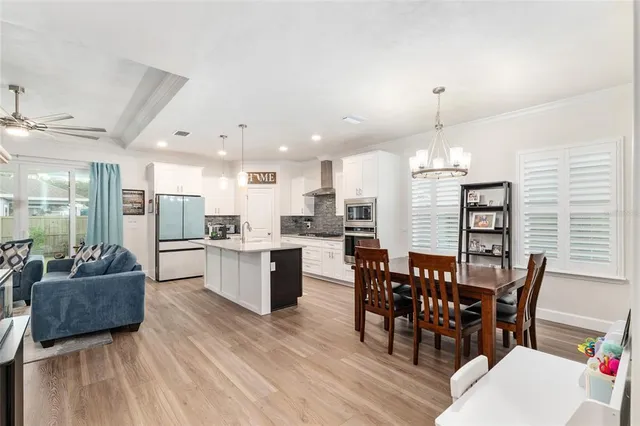a kitchen with stainless steel appliances a stove sink and cabinets