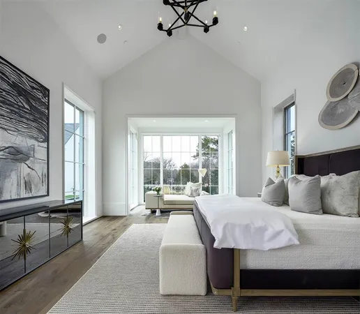 a bedroom with a bed couch and window