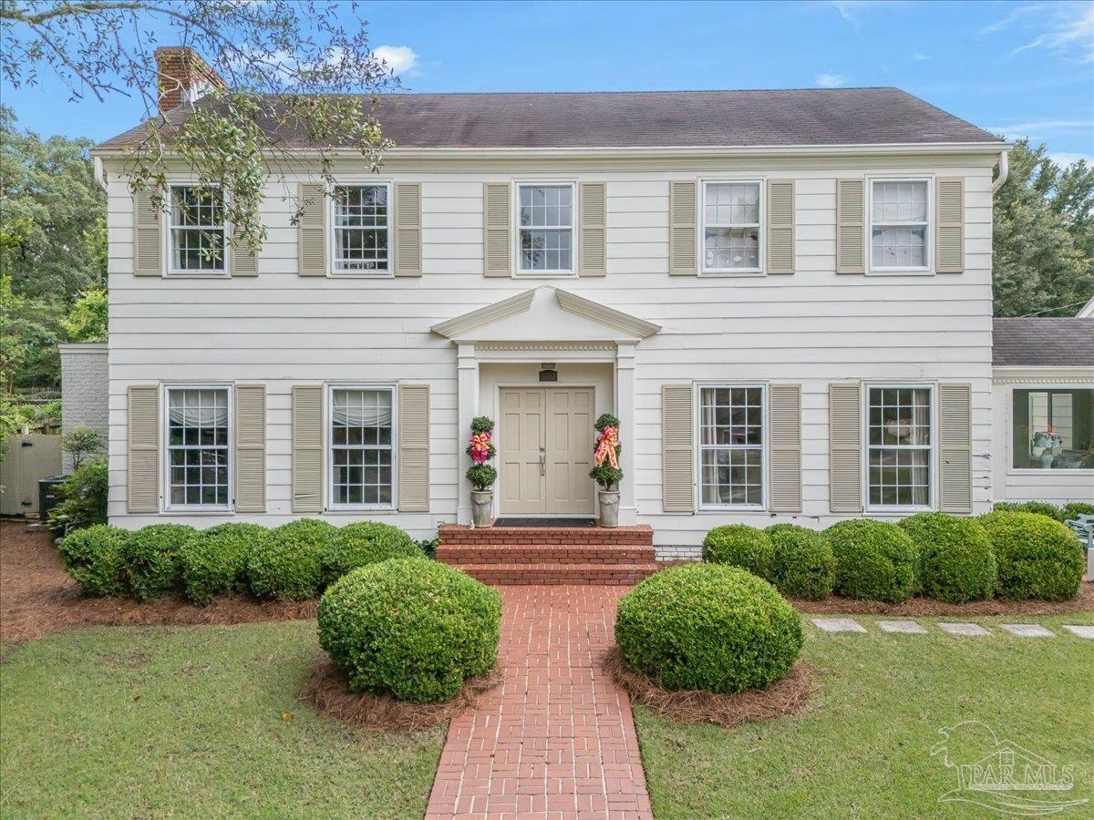 3361 Palermo Road Pensacola, FL 32503 - Photo 2 of 50 front view of a brick house with a yard