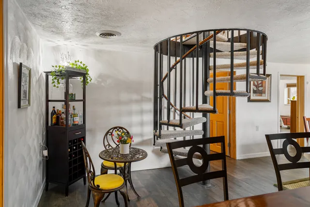 a view of a chairs and table in kitchen