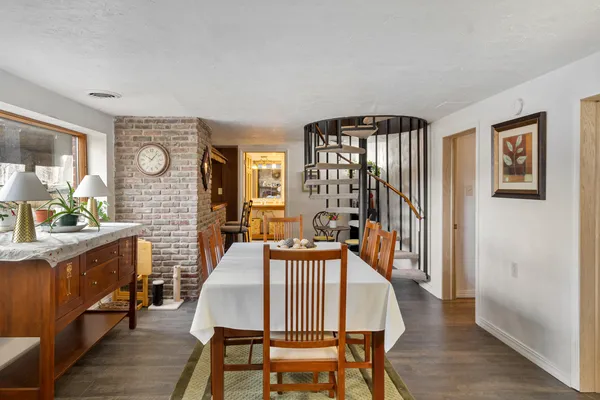 a view of a dining room with furniture window and wooden floor