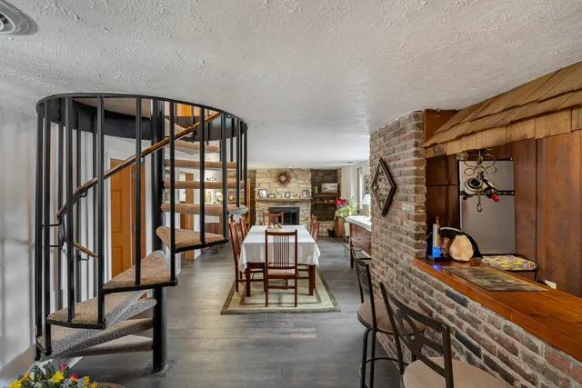 a view of entryway with furniture and wooden floor