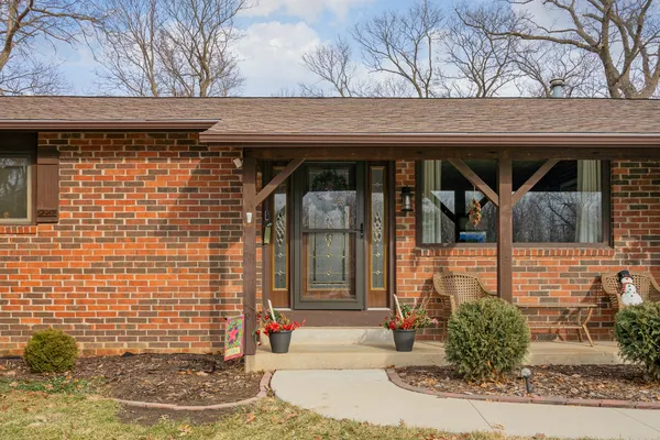 a view of a wooden door of the house