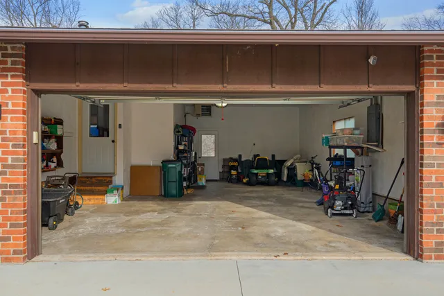 a view of a garage with rack and bicycle