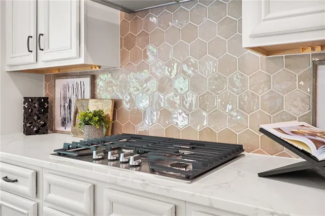 a spacious bathroom with a double vanity sink a mirror a bathtub and next to a window